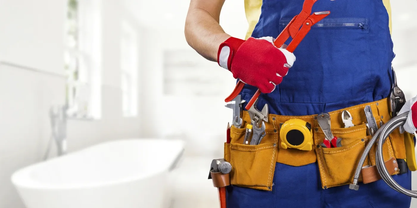 The torso of plumbing technician showing a tool belt from Quality Plumber Leander in Leander, TX - Toilet Solutions